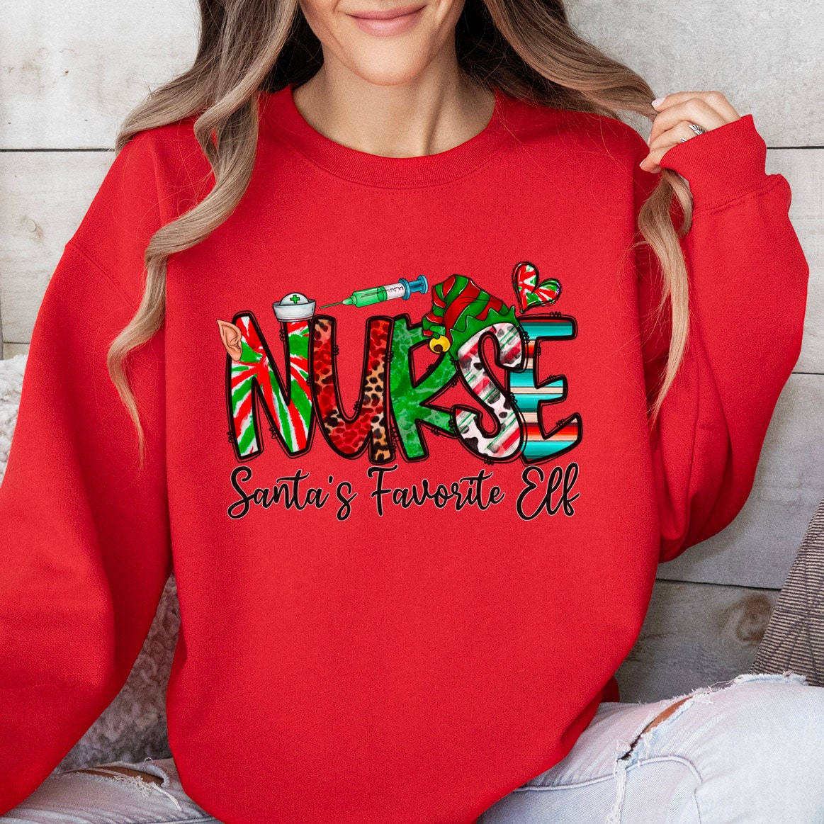 Sweat-shirt de Noël préféré du lutin du Père Noël, chemise d'elfe, sweat-shirt de vacances, chemise cadeau du Père Noël, sweat-shirt unisexe, cadeau pour elle, cadeau pour lui