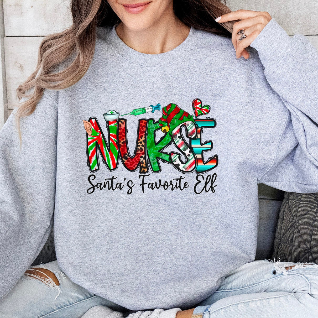 Sweat-shirt de Noël préféré du lutin du Père Noël, chemise d'elfe, sweat-shirt de vacances, chemise cadeau du Père Noël, sweat-shirt unisexe, cadeau pour elle, cadeau pour lui